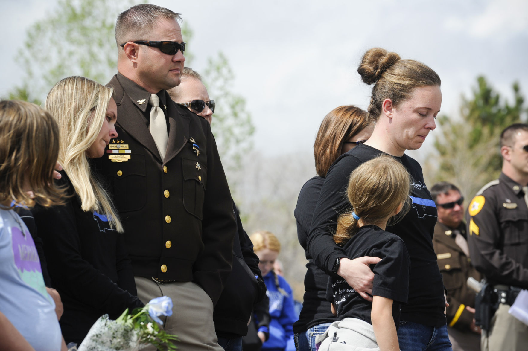 People gather on Highway 287